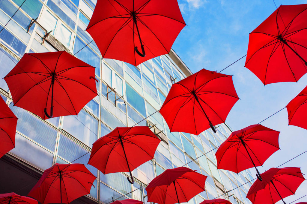 Red umbrellas as street decoration and shade